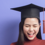 Woman with a degree smiling