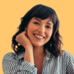 Woman smiling with a yellow background